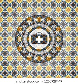medical briefcase icon inside arabic badge background. Arabesque decoration.