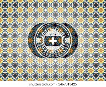 medical briefcase icon inside arabic badge. Arabesque decoration.