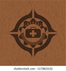 medical briefcase icon inside badge with wood background