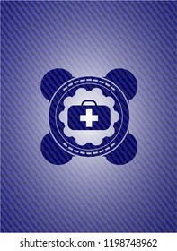 medical briefcase icon inside badge with denim background