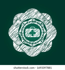 medical briefcase icon inside chalk emblem written on a blackboard