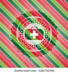 medical briefcase icon inside christmas colors emblem.
