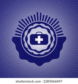 medical briefcase icon inside emblem with jean texture. 