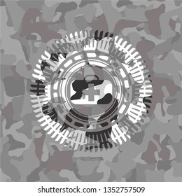 medical briefcase icon inside grey camouflage texture