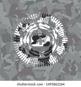 medical briefcase icon inside grey camouflaged emblem