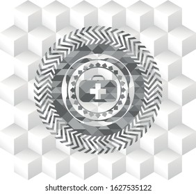 medical briefcase icon inside grey badge with geometric cube white background