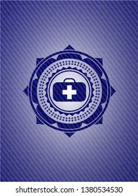 medical briefcase icon inside jean or denim emblem or badge background