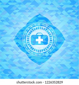 medical briefcase icon inside light blue mosaic emblem