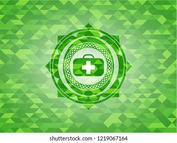 medical briefcase icon inside realistic green emblem. Mosaic background