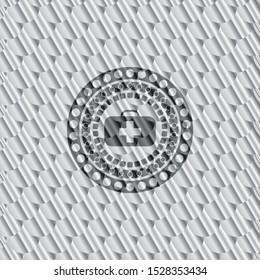 medical briefcase icon inside silver badge or emblem. Scales pattern. Vector Illustration. Detailed.