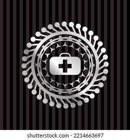 medical briefcase icon inside silver shiny emblem. 