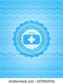 medical briefcase icon inside water concept style emblem.