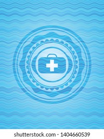 medical briefcase icon inside water wave concept emblem background.