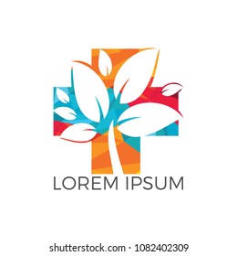 Medical cross and green leafs vector logo concept illustration. Natural Health Care Logo, Natural Treatment Logo.