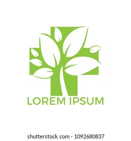 Medical cross and green leafs vector logo concept illustration. Natural Health Care Logo, Natural Treatment Logo.