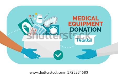 Medical equipment donation during coronavirus covid-19 pandemic, volunteer holding a donation box filled with medicines, surgical gloves and face masks, solidarity concept