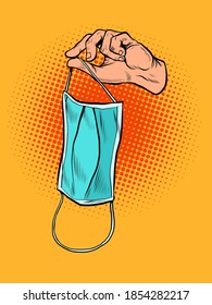 Medical mask in hand. Pop art retro illustration vintage kitsch 50s 60s style