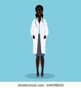 Medical physician doctor woman on blue background. Young african woman doctor of holding hands in pockets of white medical gown.
