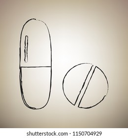 Medical pills sign. Vector. Brush drawed black icon at light brown background.