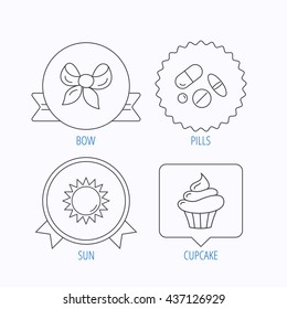 Medical pills, sun and bow-knot icons. Cupcake linear sign. Award medal, star label and speech bubble designs. Vector