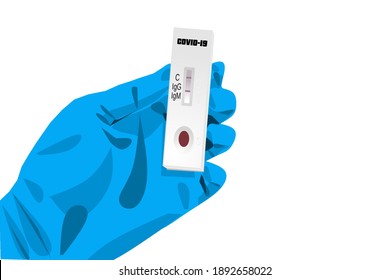 Medical staff's hand wearing blue glove holding a covid-19 test kit that states a positive result.
Corona virus screening test. 
