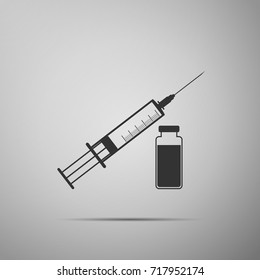 Medical syringe with needle and vial, concept of vaccination, injection icon isolated on grey background. Flat design. Vector Illustration