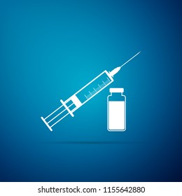 Medical syringe with needle and vial icon isolated on blue background. Concept of vaccination, injection. Flat design. Vector Illustration