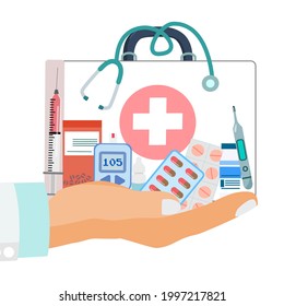 Medication elements concept, bear hand holding first aid bag, medicines, vial, syringe, glucose meter, thermometer and stethoscope 