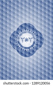 medicinal weed icon inside blue badge with geometric pattern.