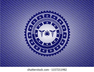 medicinal weed icon inside emblem with denim high quality background