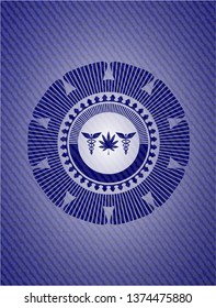 medicinal weed icon inside emblem with jean background