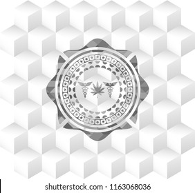 medicinal weed icon inside grey badge with geometric cube white background