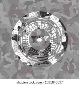 medicinal weed icon inside grey camouflaged emblem