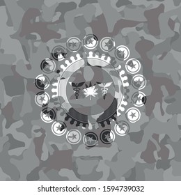 medicinal weed icon inside grey camo emblem