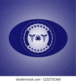 medicinal weed icon inside jean or denim emblem or badge background