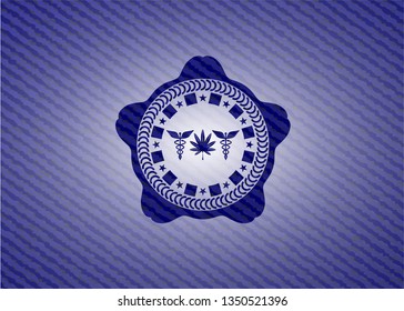 medicinal weed icon inside jean or denim emblem or badge background
