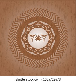 medicinal weed icon inside wood badge or emblem