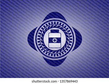 medicine bottle icon inside emblem with denim high quality background