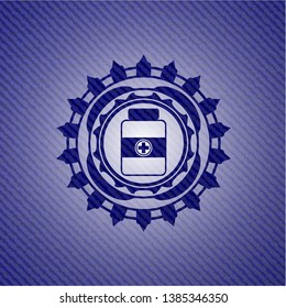 medicine bottle icon inside emblem with denim texture