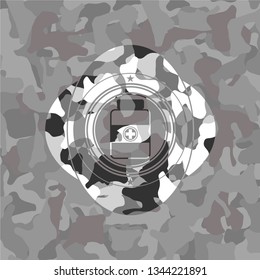 medicine bottle icon inside grey camouflaged emblem