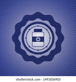 medicine bottle icon inside jean or denim emblem or badge background