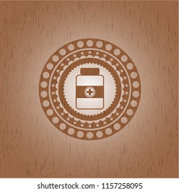  medicine bottle icon inside wooden emblem