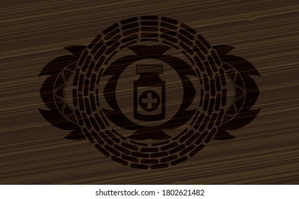 medicine bottle icon inside wooden realistic emblem. Brown fancy background. Intense illustration. 