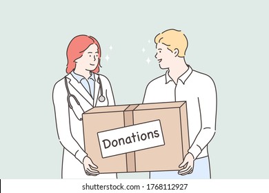 Medicine, health, help support, donation concept. Young man and woman doctor holding huge bog with donations medical face masks and treatment from viruses deseases. Humanitarian support or goodwill