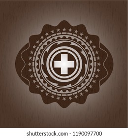 medicine icon inside badge with wood background