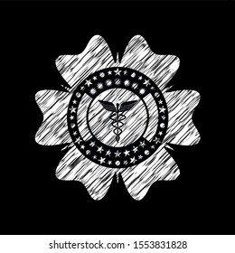 medicine icon inside chalkboard emblem on black board