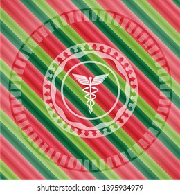 medicine icon inside christmas colors emblem.
