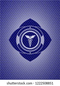 medicine icon inside emblem with denim high quality background