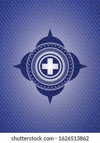 medicine icon inside emblem with denim texture