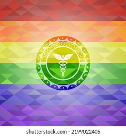 medicine icon inside emblem on mosaic background with the colors of the LGBT flag. 